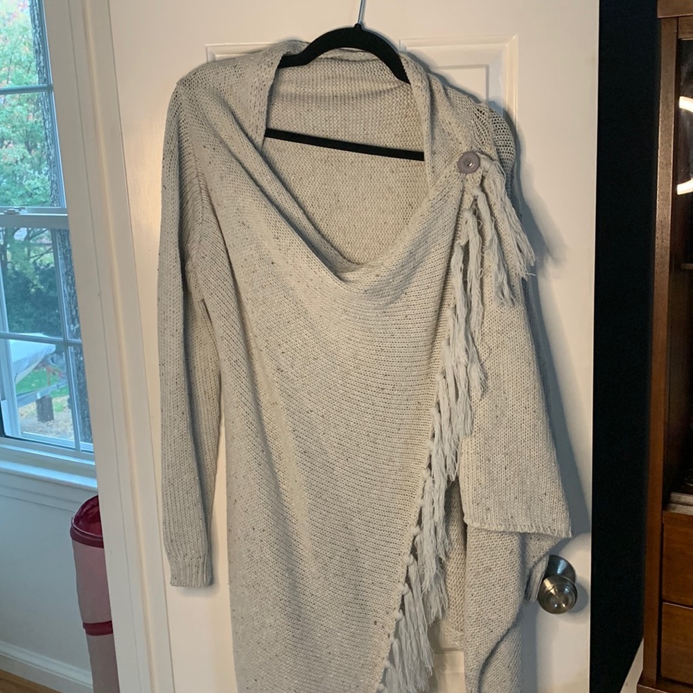 Fringe poncho style sweater
